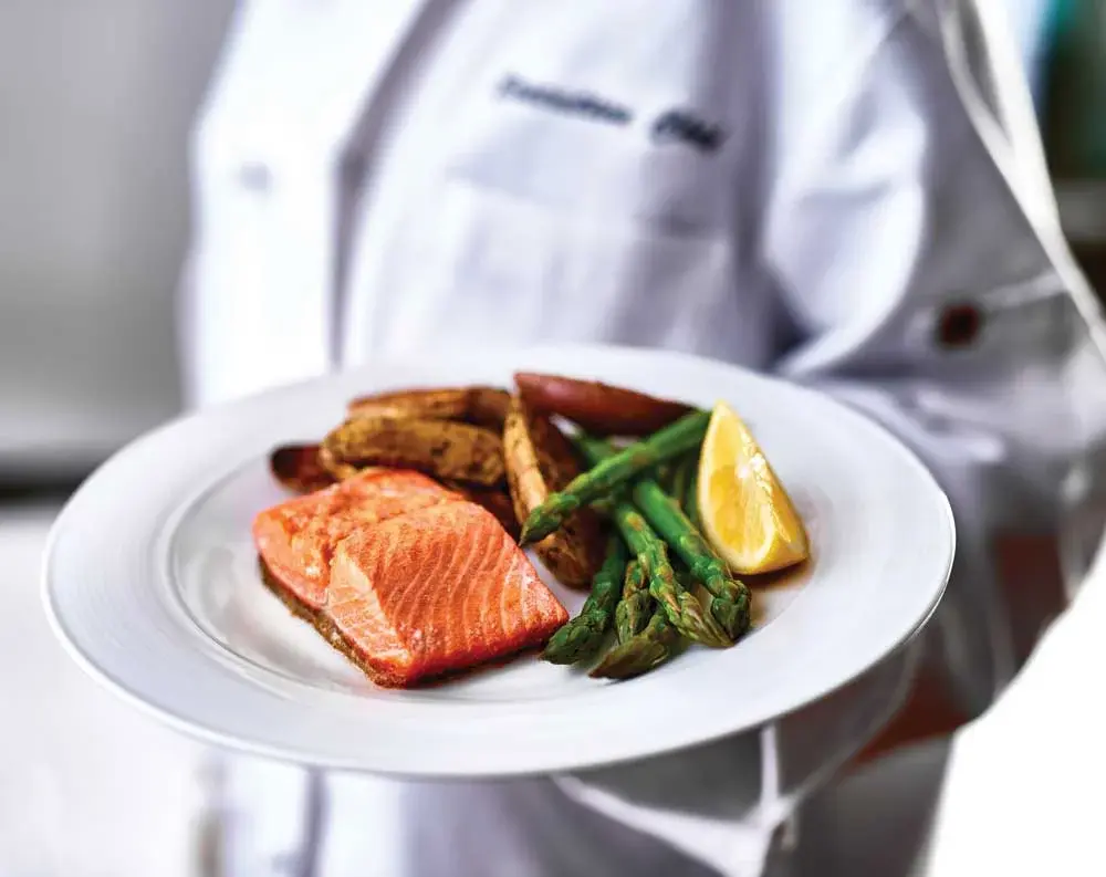 Estrella Estates Chef Created Meals, chef delivering a finished dish.